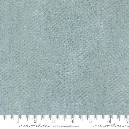 Image of Chilly White Out Storm quilting cotton fabric by Sweetwater for Moda Fabrics. Features printed texture on a blue background. Cute Little Fabric Shop.