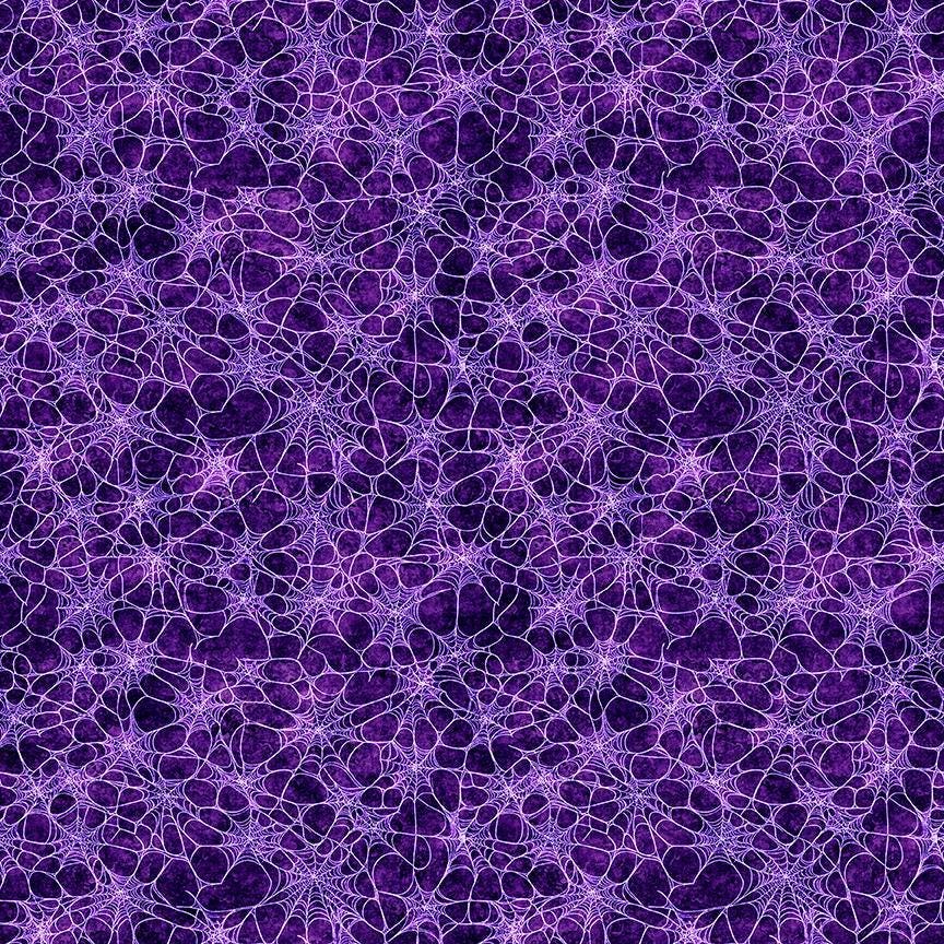 Image of Witchypoo Spiderwebs Purple quilting cotton fabric by Morris Creative Group for QT Fabrics. Features spiderwebs on a purple background. Cute Little Fabric Shop.