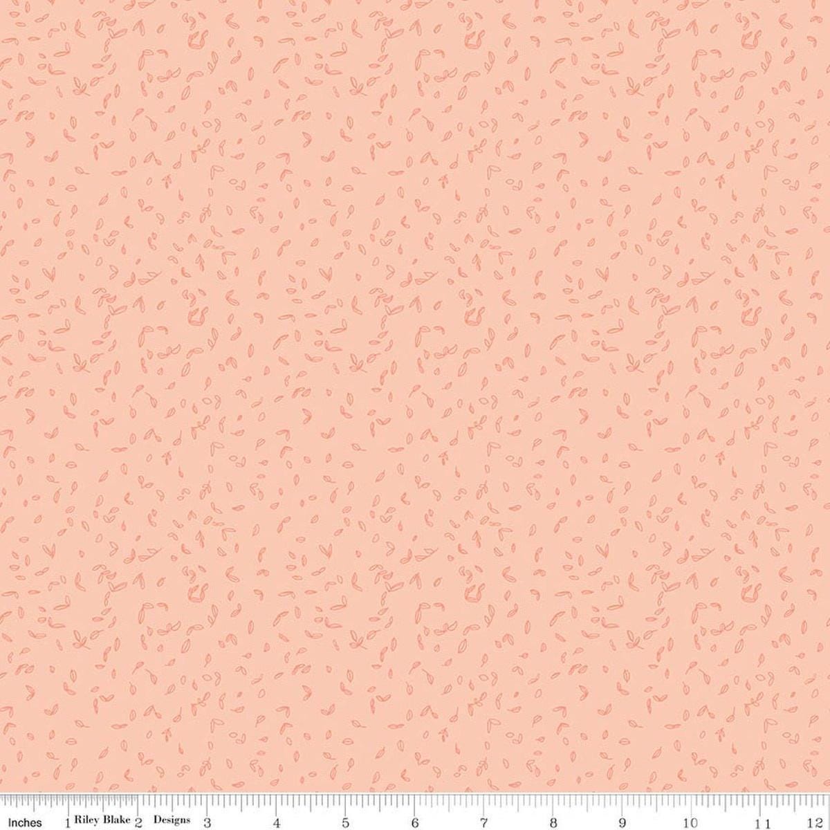 Image of Tangled Gardens Seedling Blush quilting cotton fabric by Diane Labombarbe for Riley Blake Designs. Features leaves on a pink background. Cute Little Fabric Shop.