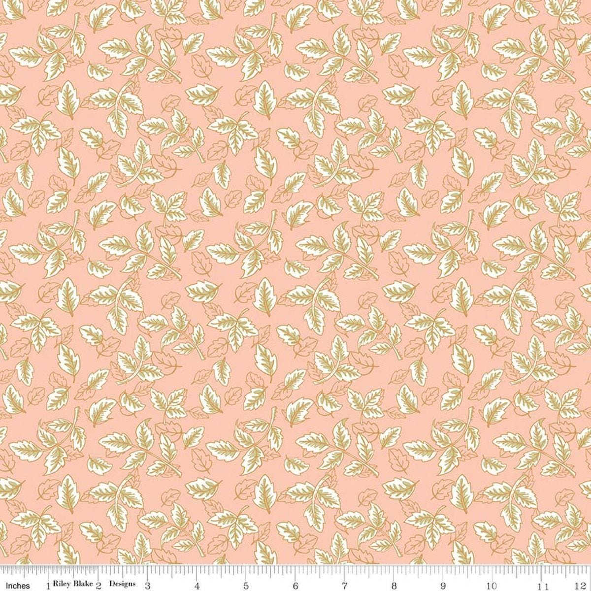Image of Tangled Gardens Leaves Blush quilting cotton fabric by Diane Labombarbe for Riley Blake Designs. Features leaves on a pink background. Cute Little Fabric Shop.