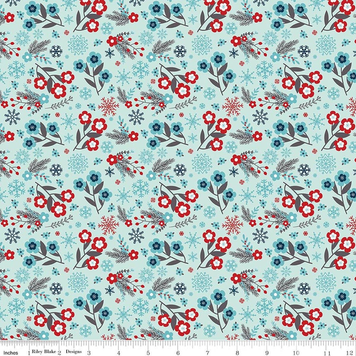 Image of A Perfect Winter Flowers Powder quilting cotton fabric by Lori Whitlock for Riley Blake Designs. Features flowers on a blue background. Cute Little Fabric Shop.