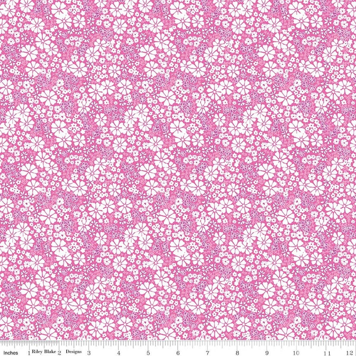 Image of Chasing Rainbows Everbloom Pink quilting cotton fabric by Leslie Ryan for Riley Blake Designs. Features flowers on a pink background. Cute Little Fabric Shop.