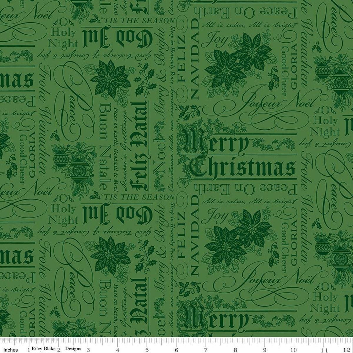 Image of Poinsettias at Christmas Text Green quilting cotton fabric by Jennifer Bosworth for Riley Blake Designs. Features words on a green background. Cute Little Fabric Shop.