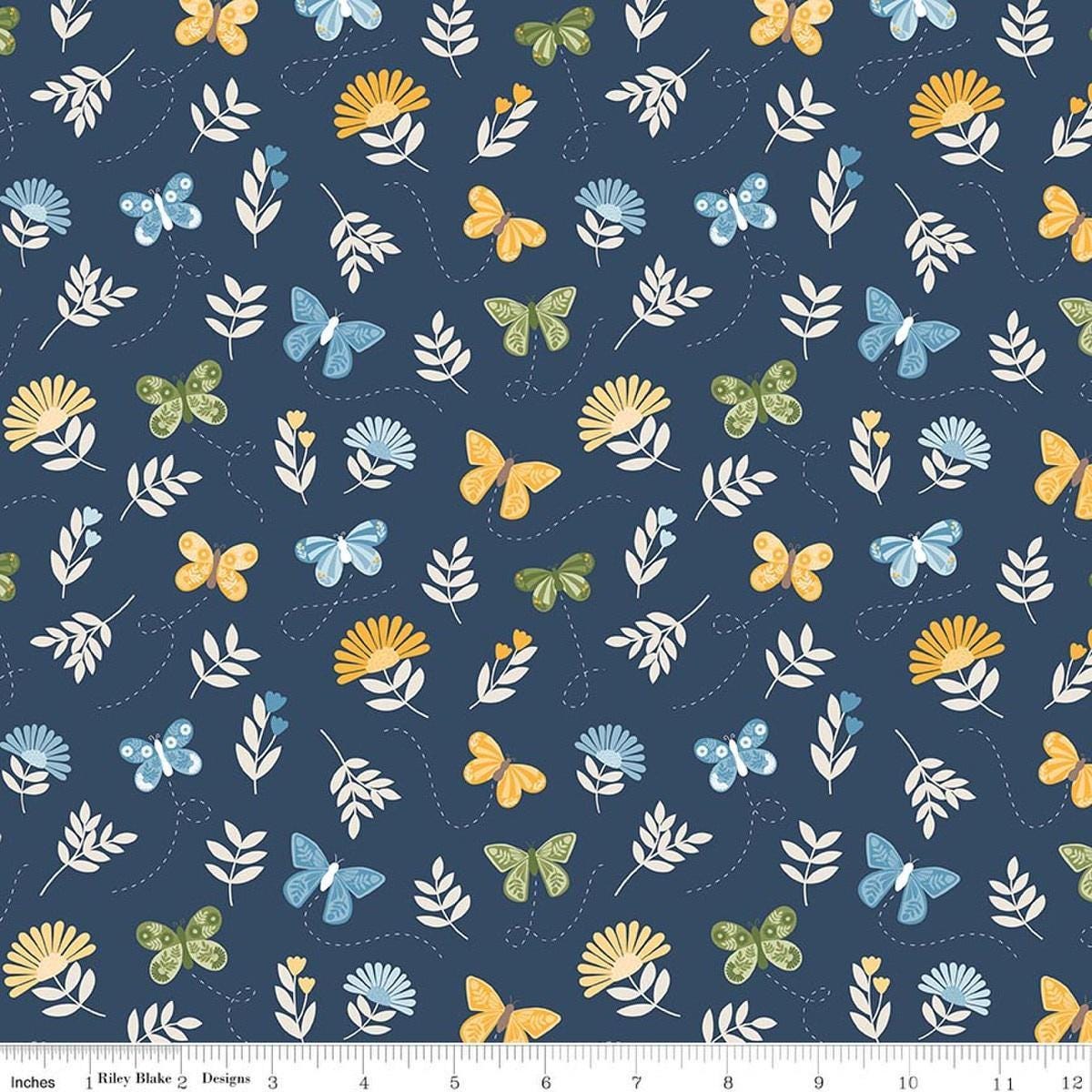 Image of Sunshine & Dandelions Butterflies Navy quilting cotton fabric by Traci Reed for Riley Blake Designs. Features butterflies on a blue background. Cute Little Fabric Shop.
