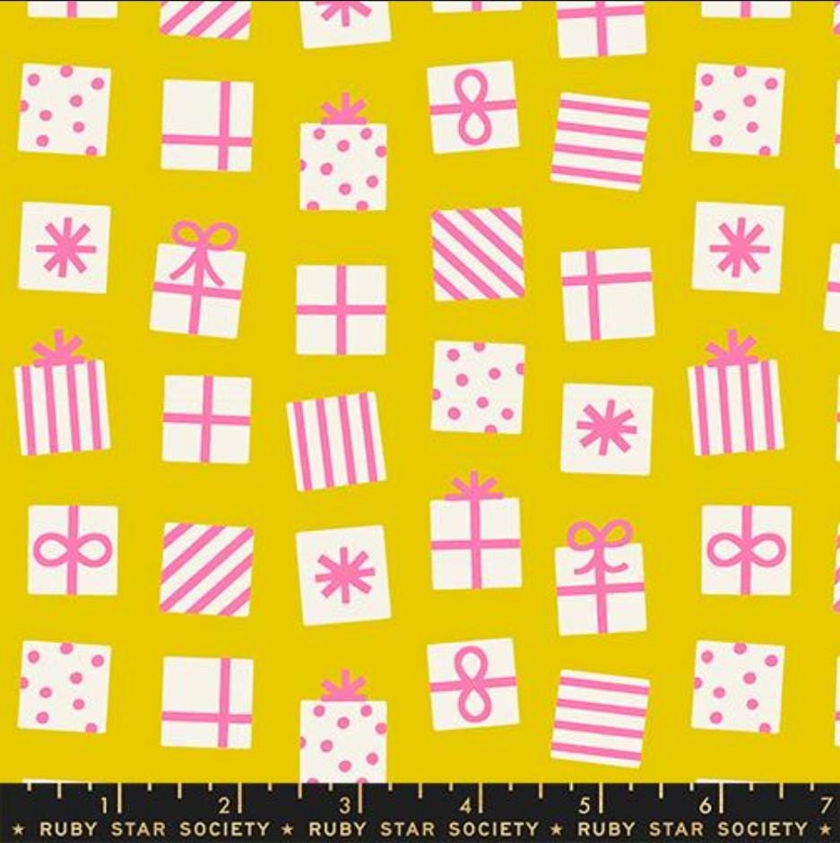 Image of Merry Happy Secret Santa Golden Hour quilting cotton fabric by Kimberly Kight of Ruby Star Society for Moda Fabrics. Features presents on a yellow background. Cute Little Fabric Shop.