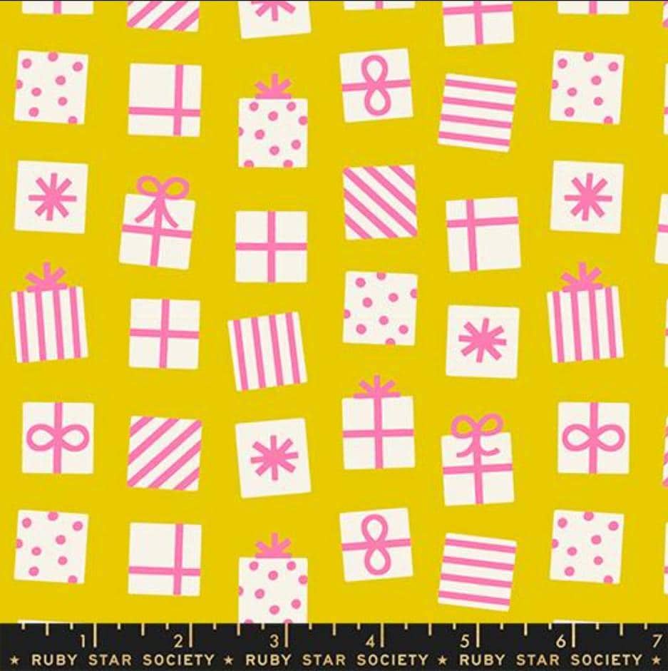 Image of Merry Happy Secret Santa Golden Hour quilting cotton fabric by Kimberly Kight of Ruby Star Society for Moda Fabrics. Features presents on a yellow background. Cute Little Fabric Shop.