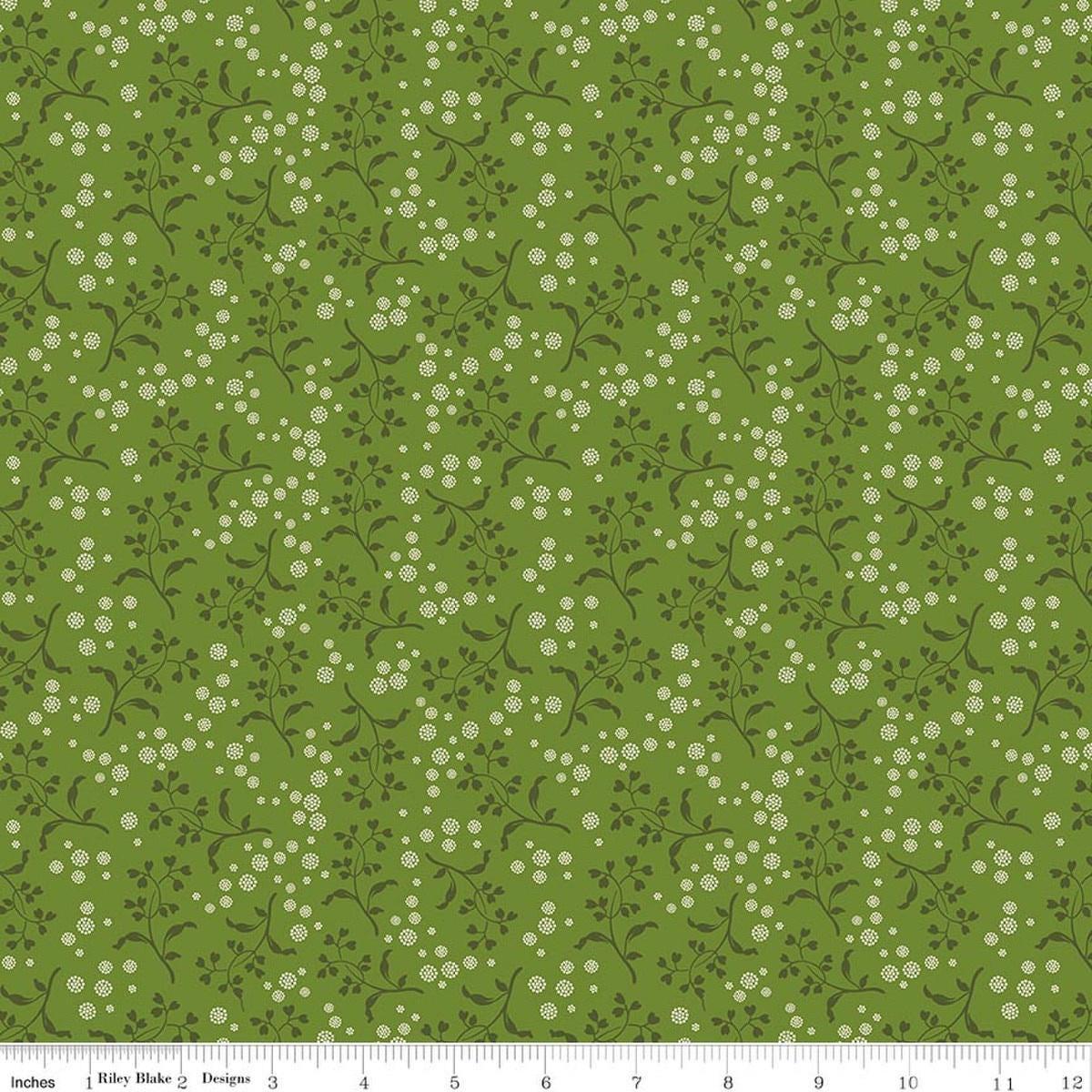 Image of Baked With Love Apron Olive quilting cotton fabric by Lori Holt for Riley Blake Designs. Features flowers on a green background. Cute Little Fabric Shop.