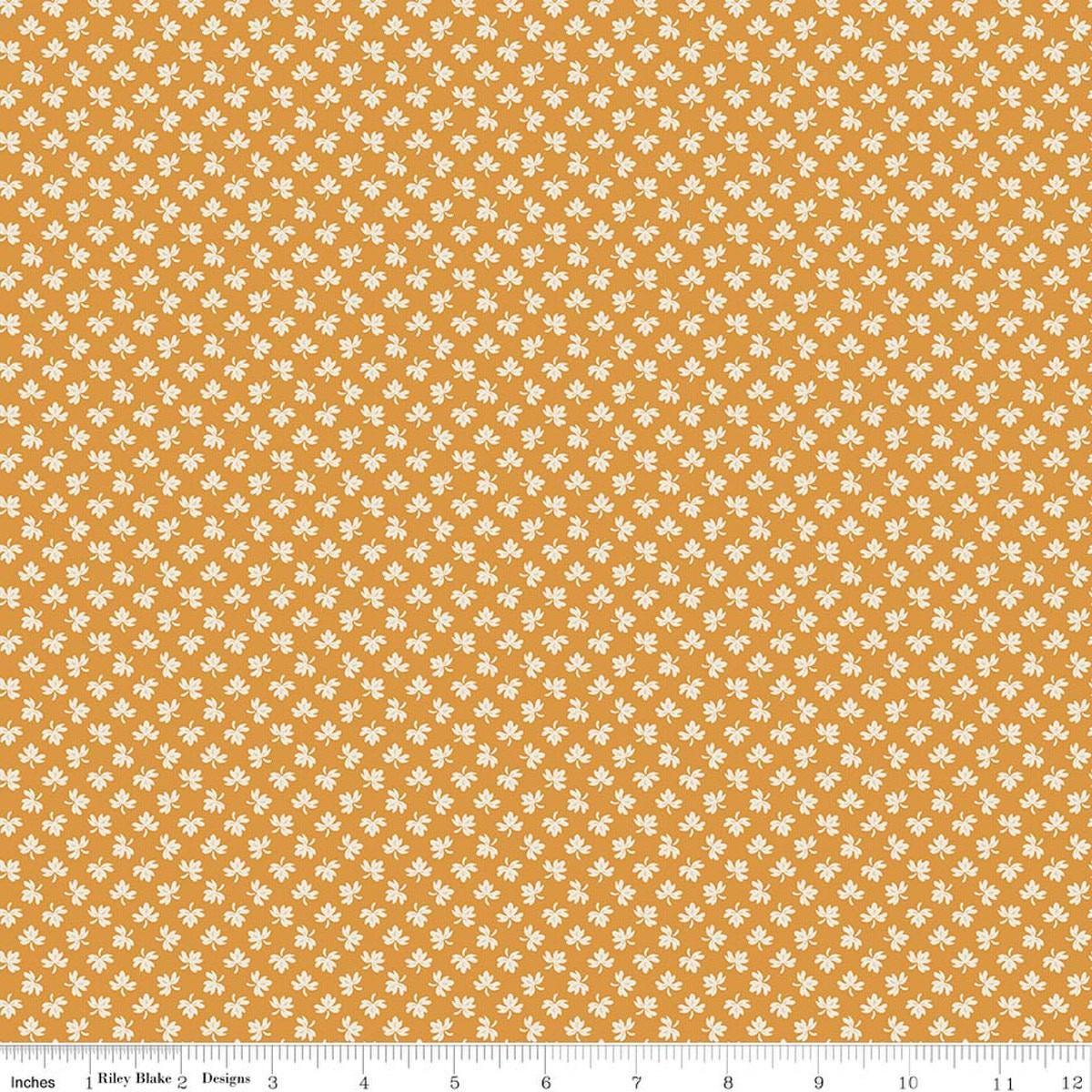 Image of Baked With Love Gathering Spice quilting cotton fabric by Lori Holt for Riley Blake Designs. Features leaves on an orange background. Cute Little Fabric Shop.