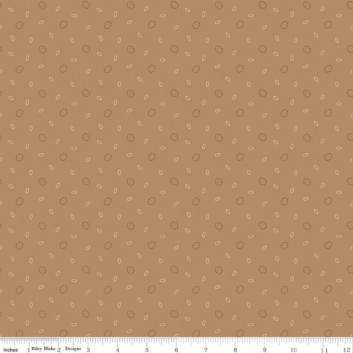 Image of Baked With Love Grandma's Pear Maple quilting cotton fabric by Lori Holt for Riley Blake Designs. Features circles on a brown background. Cute Little Fabric Shop.