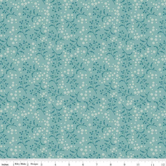 Image of Baked With Love Apron Wedgewood quilting cotton fabric by Lori Holt for Riley Blake Designs. Features flowers on a blue background. Cute Little Fabric Shop.