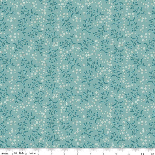Image of Baked With Love Apron Wedgewood quilting cotton fabric by Lori Holt for Riley Blake Designs. Features flowers on a blue background. Cute Little Fabric Shop.
