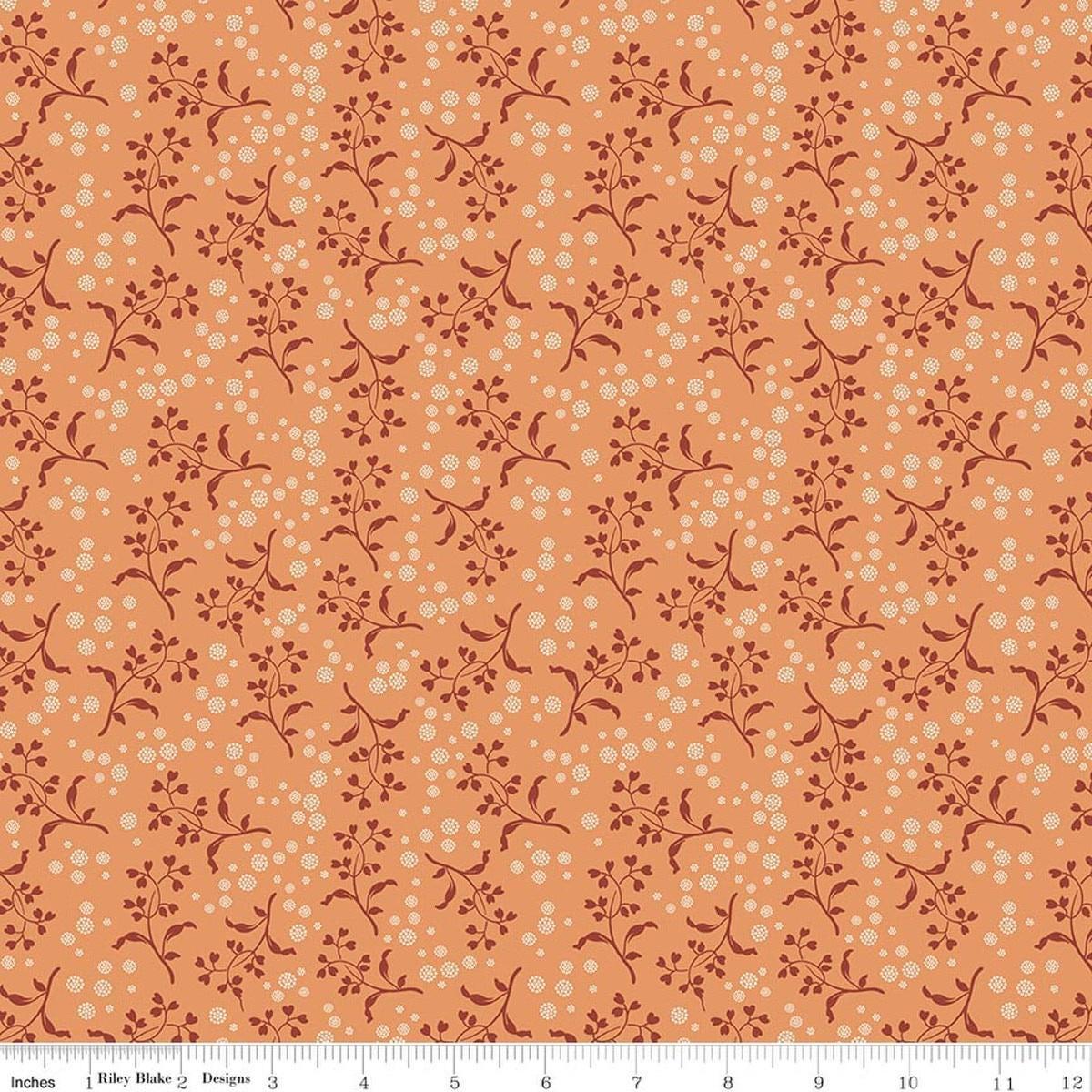 Image of Baked With Love Apron Squash quilting cotton fabric by Lori Holt for Riley Blake Designs. Features flowers on an orange background. Cute Little Fabric Shop.