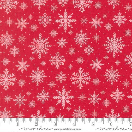 Image of Merrily on High Softly Snowing Christmas Red quilting cotton fabric by Sweetfire Road for Moda Fabrics. Features snowflakes on a red background. Cute Little Fabric Shop.