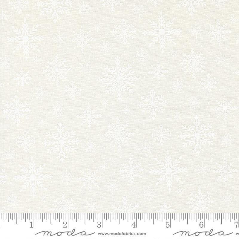 Image of Merrily on High Softly Snowing Snow White quilting cotton fabric by Sweetfire Road for Moda Fabrics. Features tonal snowflakes on a white background. Cute Little Fabric Shop.