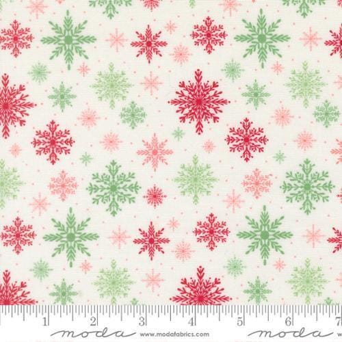 Image of Merrily on High Softly Snowing Snow quilting cotton fabric by Sweetfire Road for Moda Fabrics. Features snowflakes on a white background. Cute Little Fabric Shop.
