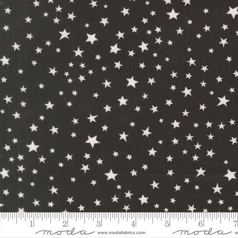 Image of Purrs and Boos Stars Black Cat quilting cotton fabric by Elena Amo for Moda Fabrics. Features stars on a black background. Cute Little Fabric Shop.