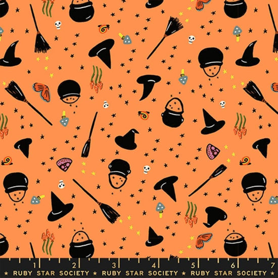 Image of Freaky Familiars Witchy Woman Pumpkin quilting cotton fabric by Ruby Star Society for Moda Fabrics. Features witch accessories on an orange background. Cute Little Fabric Shop.