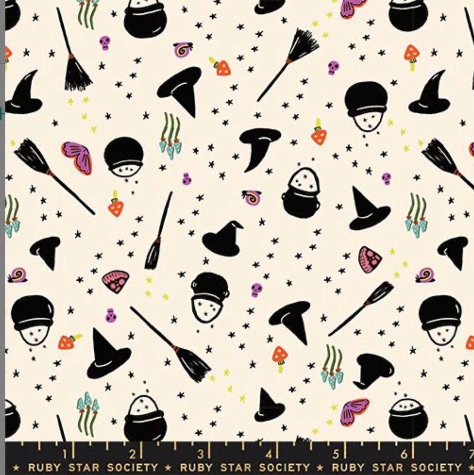 Image of Freaky Familiars Witchy Woman Natural quilting cotton fabric by Ruby Star Society for Moda Fabrics. Features witchy accessories on a cream background. Cute Little Fabric Shop.