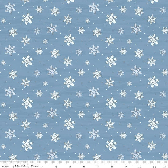Image of Covered Bridges in Winter Snowflakes Blue quilting cotton fabric by Tara Reed for Riley Blake Designs. Features snowflakes on a blue background. Cute Little Fabric Shop.