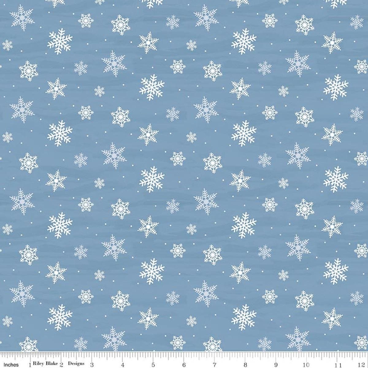 Image of Covered Bridges in Winter Snowflakes Blue quilting cotton fabric by Tara Reed for Riley Blake Designs. Features snowflakes on a blue background. Cute Little Fabric Shop.