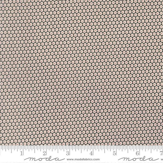 Image of Chilly Snowball Coal quilting cotton fabric by Sweetwater for Moda Fabrics. Features a geometric pattern on a black background. Cute Little Fabric Shop.