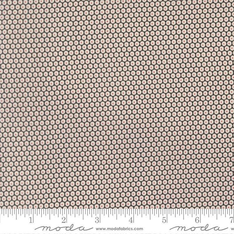 Image of Chilly Snowball Coal quilting cotton fabric by Sweetwater for Moda Fabrics. Features a geometric pattern on a black background. Cute Little Fabric Shop.