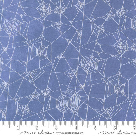 Image of Coven Spider Web Dusk quilting cotton fabric by Robin Pickens for Moda Fabrics. Features spiderwebs on a blue background. Cute Little Fabric Shop.