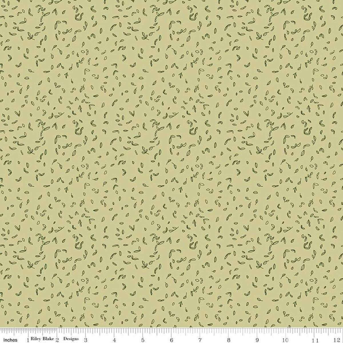 Image of Tangled Gardens Seedlings Celery quilting cotton fabric by Diane Labombarbe for Riley Blake Designs. Features leaves on a green background. Cute Little Fabric Shop.