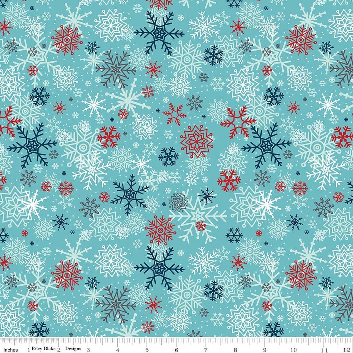 Image of A Perfect Winter Snowflakes Blue quilting cotton fabric by Lori Whitlock for Riley Blake Designs. Features snowflakes on a blue background. Cute Little Fabric Shop.
