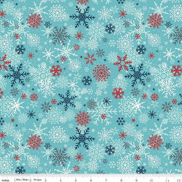 Image of A Perfect Winter Snowflakes Blue quilting cotton fabric by Lori Whitlock for Riley Blake Designs. Features snowflakes on a blue background. Cute Little Fabric Shop.