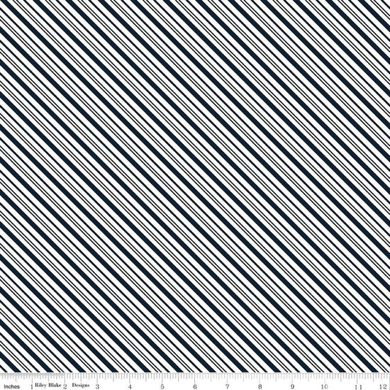Image of A Perfect Winter Stripes Navy quilting cotton fabric by Lori Whitlock for Riley Blake Designs. Features stripes on a blue background. Cute Little Fabric Shop.