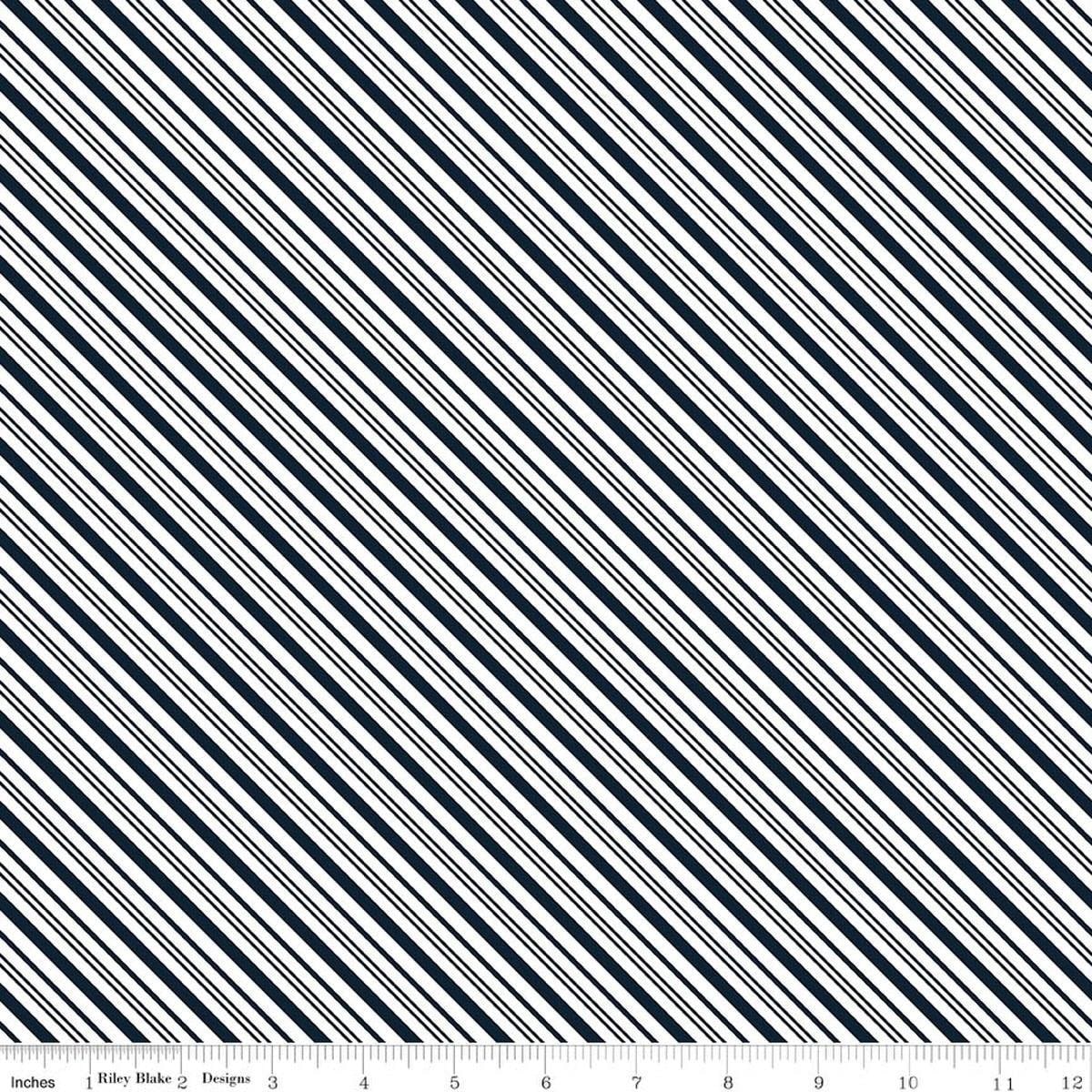 Image of A Perfect Winter Stripes Navy quilting cotton fabric by Lori Whitlock for Riley Blake Designs. Features stripes on a blue background. Cute Little Fabric Shop.