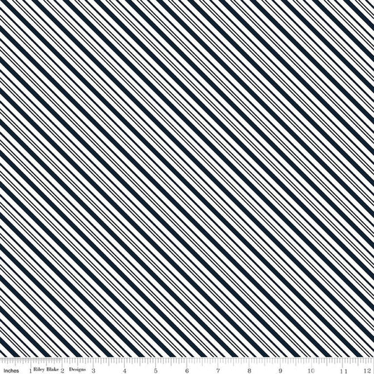 Image of A Perfect Winter Stripes Navy quilting cotton fabric by Lori Whitlock for Riley Blake Designs. Features stripes on a blue background. Cute Little Fabric Shop.