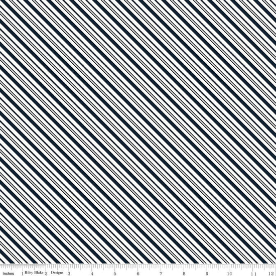 Image of A Perfect Winter Stripes Navy quilting cotton fabric by Lori Whitlock for Riley Blake Designs. Features stripes on a blue background. Cute Little Fabric Shop.