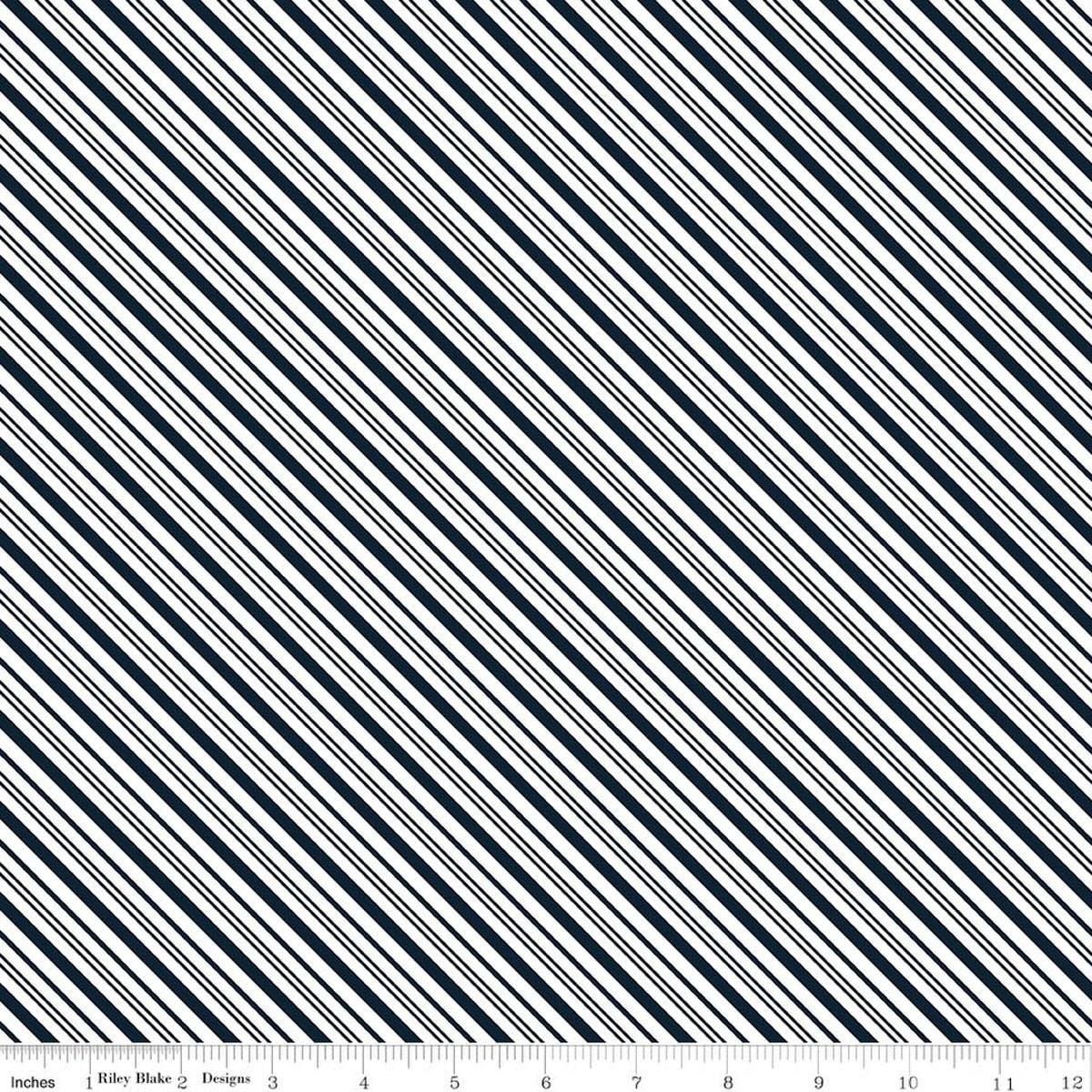 Image of A Perfect Winter Stripes Navy quilting cotton fabric by Lori Whitlock for Riley Blake Designs. Features stripes on a blue background. Cute Little Fabric Shop.
