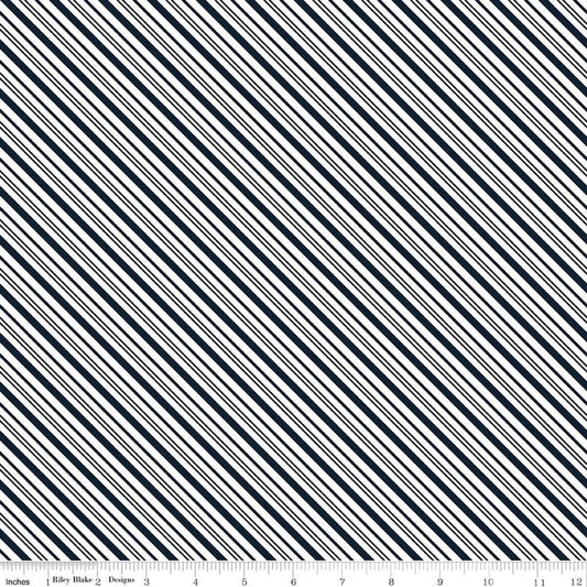 Image of A Perfect Winter Stripes Navy quilting cotton fabric by Lori Whitlock for Riley Blake Designs. Features stripes on a blue background. Cute Little Fabric Shop.
