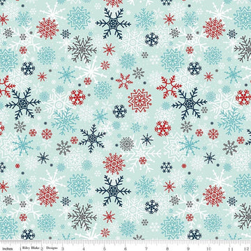 Image of A Perfect Winter Snowflakes Powder quilting cotton fabric by Lori Whitlock for Riley Blake Designs. Features snowflakes on a blue background. Cute Little Fabric Shop.