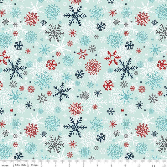 Image of A Perfect Winter Snowflakes Powder quilting cotton fabric by Lori Whitlock for Riley Blake Designs. Features snowflakes on a blue background. Cute Little Fabric Shop.