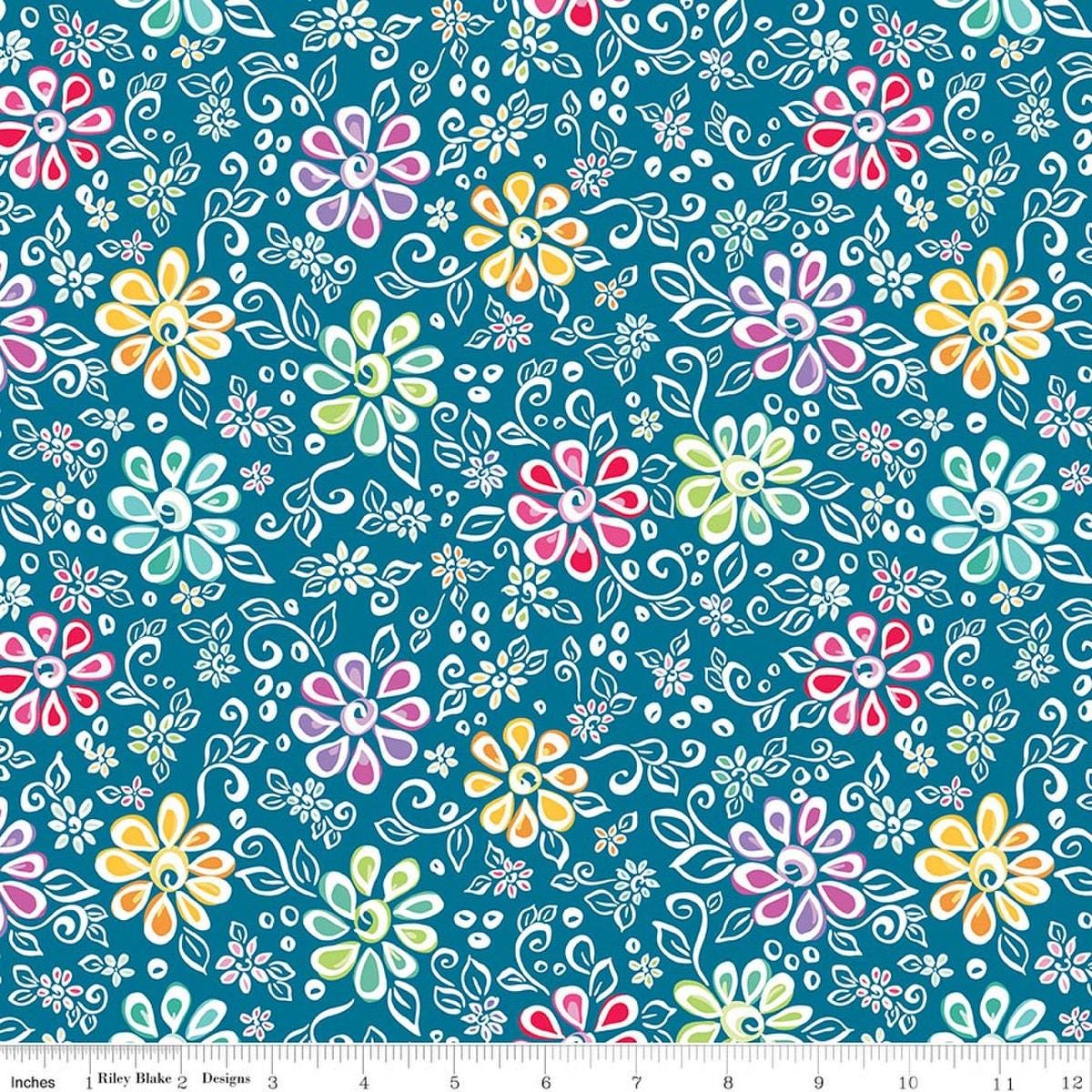 Image of Chasing Rainbows Main Paradise quilting cotton fabric by Leslie Ryan for Riley Blake Designs. Features flowers on a blue background. Cute Little Fabric Shop.
