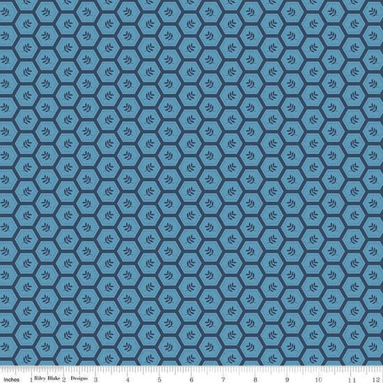 Image of Sunshine & Dandelions Hexies Blue quilting cotton fabric by Traci Reed for Riley Blake Designs. Features a geometric pattern on a blue background. Cute Little Fabric Shop.