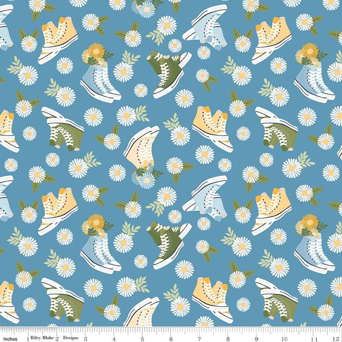 Image of Sunshine & Dandelions Shoes Blue quilting cotton fabric by Traci Reed for Riley Blake Designs. Features flowers and shoes on a blue background. Cute Little Fabric Shop.