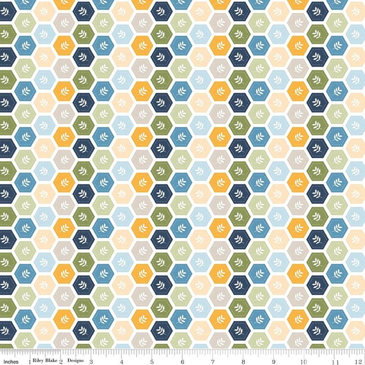 Image of Sunshine & Dandelions Hexies Multi quilting cotton fabric by Traci Reed for Riley Blake Designs. Features a geometric pattern on a blue, yellow, and green background. Cute Little Fabric Shop.