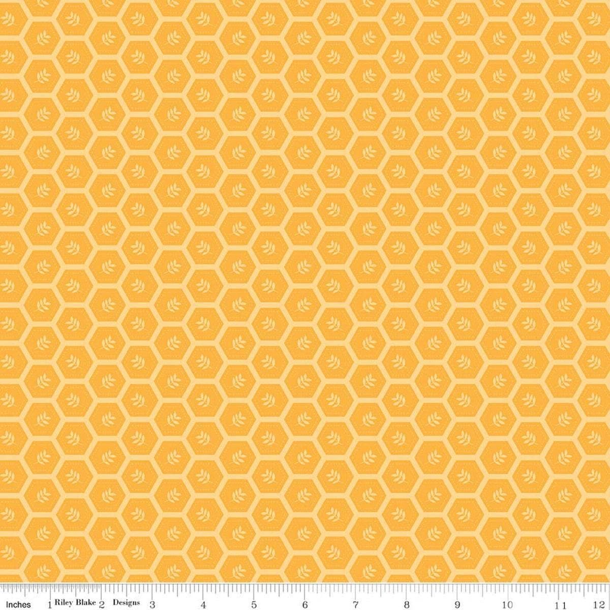 Image of Sunshine & Dandelions Hexies Daisy quilting cotton fabric by Traci Reed for Riley Blake Designs. Features a geometric pattern on a yellow background. Cute Little Fabric Shop.