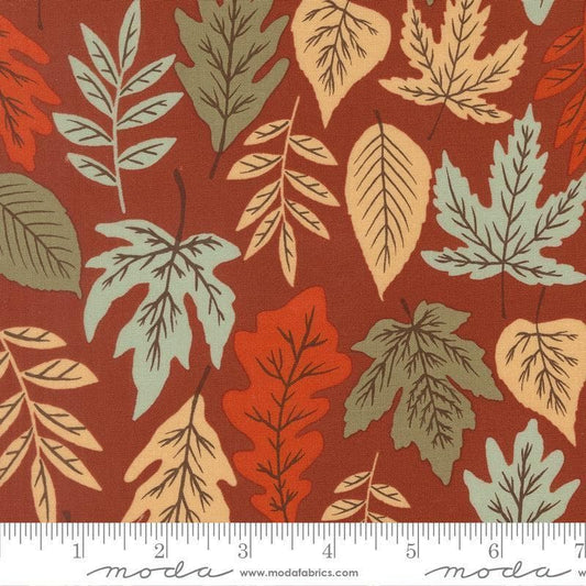 Image of Windfall Leaf Rust quilting cotton fabric by Fancy That Design House for Moda Fabric. Features leaves on a red background. Cute Little Fabric Shop.