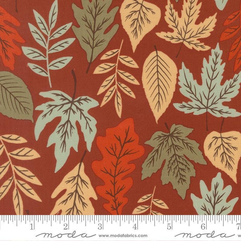 Image of Windfall Leaf Rust quilting cotton fabric by Fancy That Design House for Moda Fabric. Features leaves on a red background. Cute Little Fabric Shop.