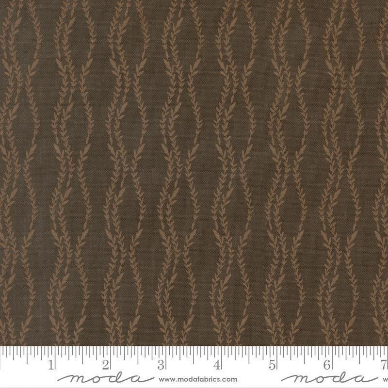 Image of Windfall Vine Stripe Dark Moss quilting cotton fabric by Fancy That Design House for Moda Fabric. Features vines on a brown background. Cute Little Fabric Shop.