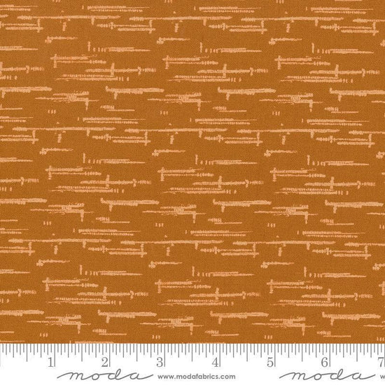 Image of Windfall Textured Blender Caramel quilting cotton fabric by Fancy That Design House for Moda Fabric. Features printed texture on a brown background. Cute Little Fabric Shop.