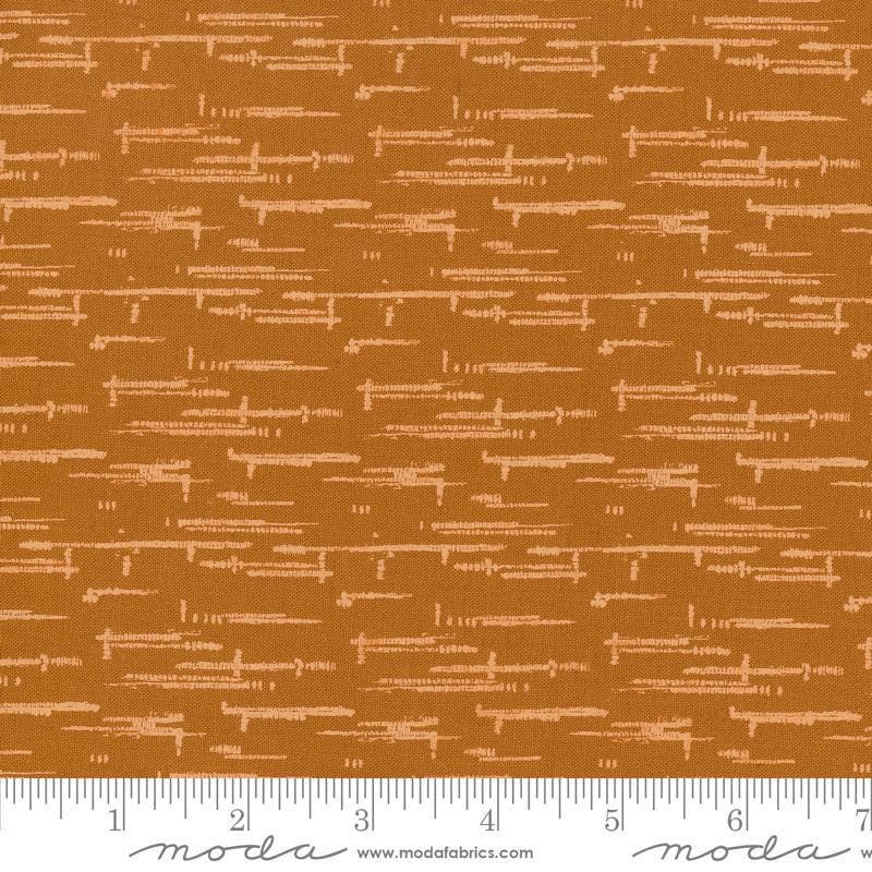 Image of Windfall Textured Blender Caramel quilting cotton fabric by Fancy That Design House for Moda Fabric. Features printed texture on a brown background. Cute Little Fabric Shop.