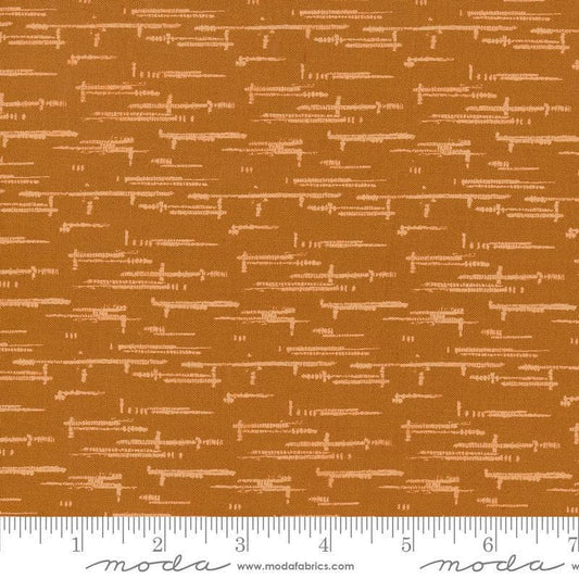 Image of Windfall Textured Blender Caramel quilting cotton fabric by Fancy That Design House for Moda Fabric. Features printed texture on a brown background. Cute Little Fabric Shop.