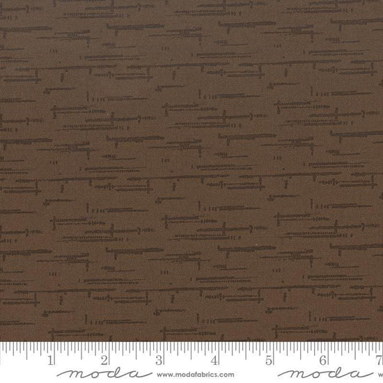 Image of Windfall Texture Blender Coffee quilting cotton fabric by Fancy That Design House for Moda Fabric. Features printed texture on a brown background. Cute Little Fabric Shop.